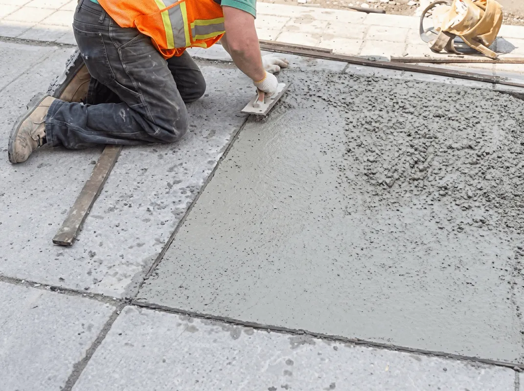 Professional repairing a concrete floor in Ann Arbor, MI